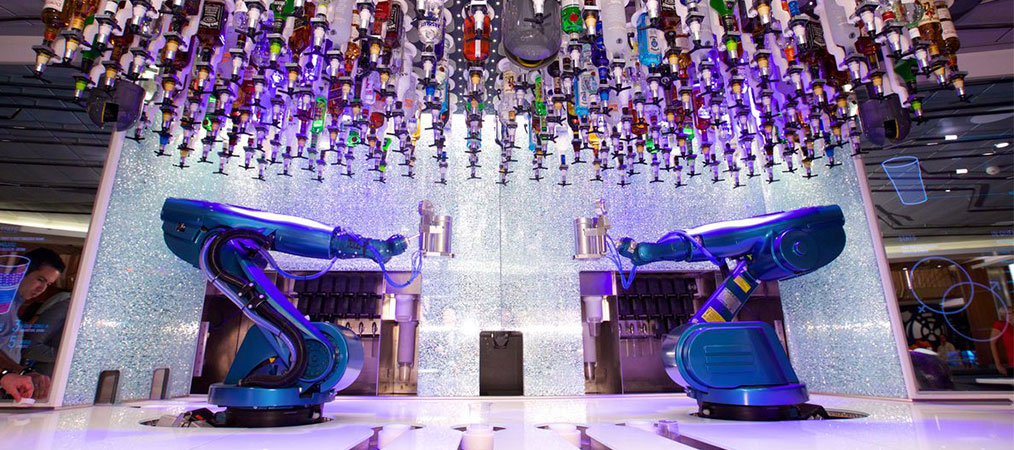 Two robotic arms making drinks at the Bionic Bar on Harmony of the Seas