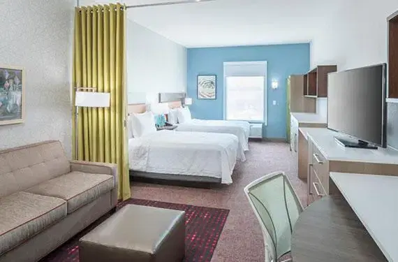 2 Queen Beds and Two-Person Sleeper Sofa