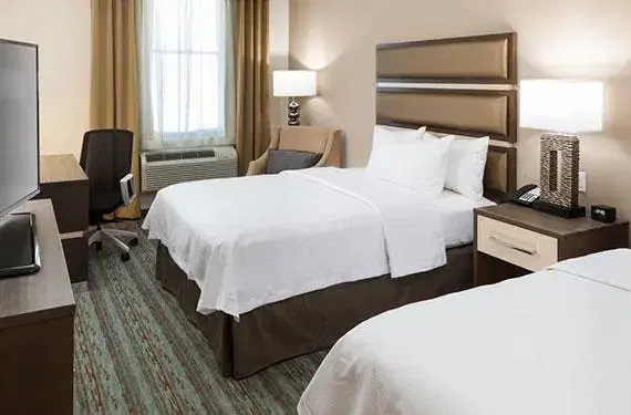 2 Queen Beds and Two-Person Sleeper Sofa