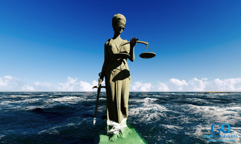 Lady of justice standing in ocean