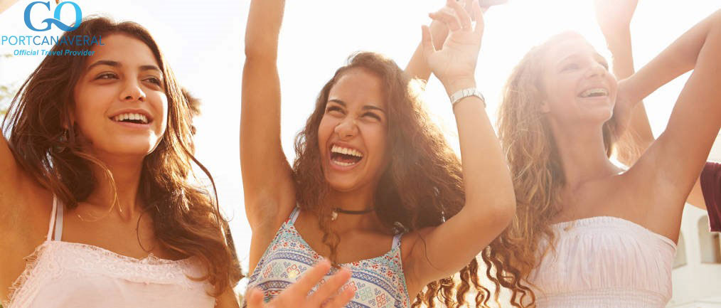 Three Teenage Girls Dancing Outdoors Against Sun