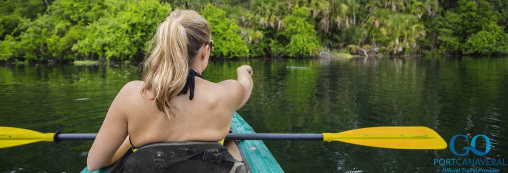 Woman kayaker pointing at an alligator
