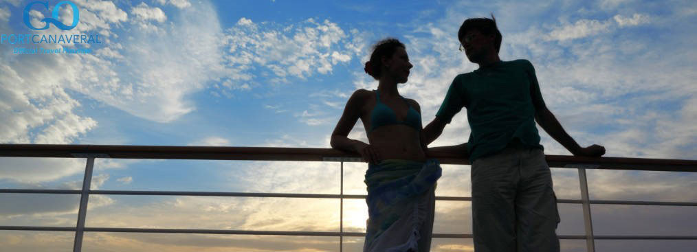 man and woman on deck of cruise ship. man looking at woman and woman looking at man.