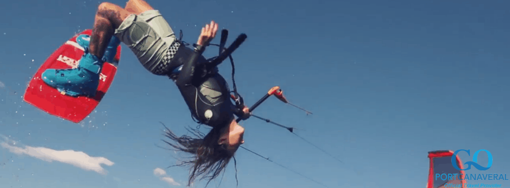 man doing trick while kiteboarding