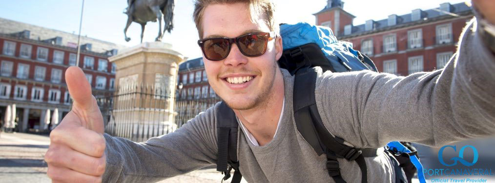 Happy man wearing a backpack