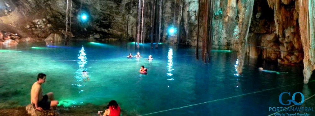 Swimmers inside of a yucatan cenote