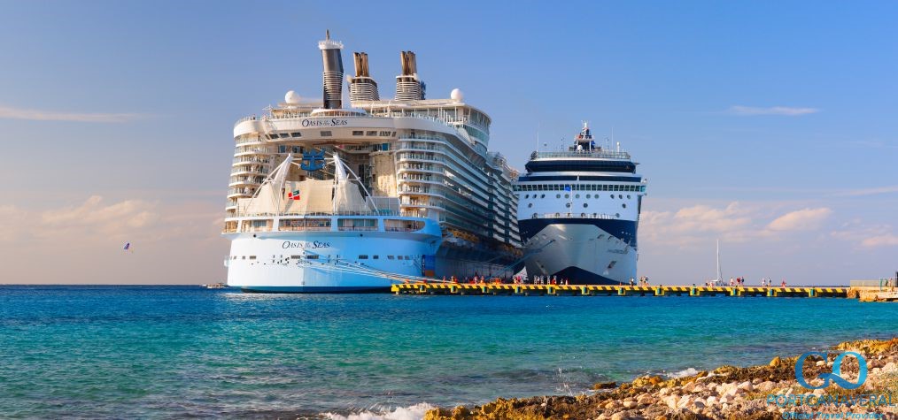 Oasis of the seas, the largest ship in the world, dwarfing another cruise ship