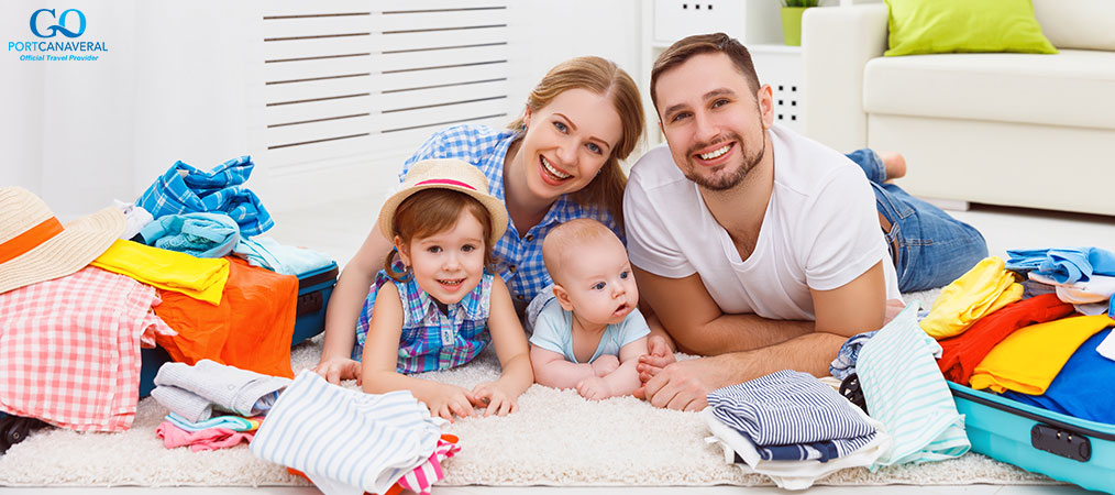 parents with young kids packing for cruise vacation