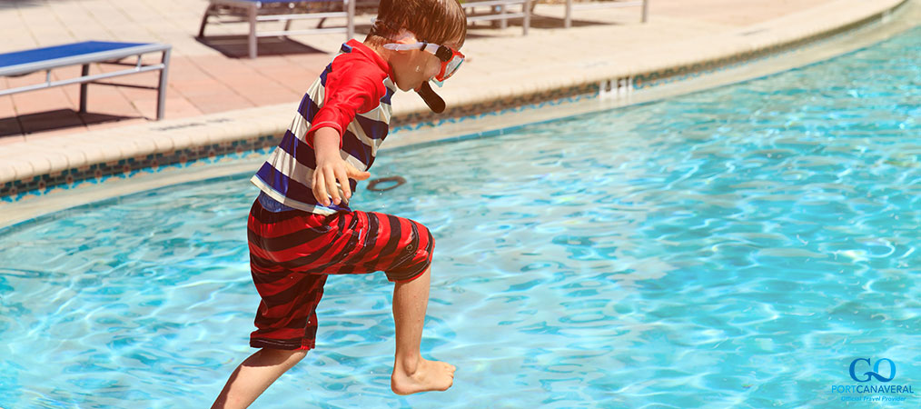 kid jumping into the pool