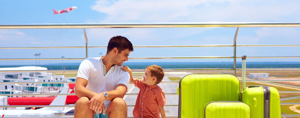 family waiting for boarding in international airport summer vacation