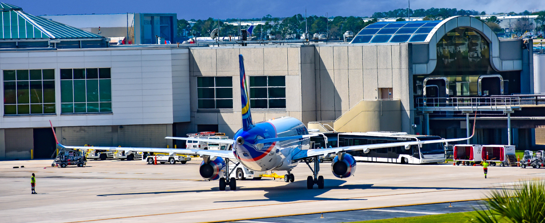 Blue plane taxiing on the runway