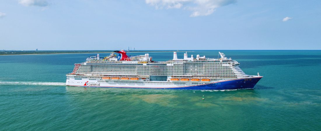 Carnival Mardi Gras cruise ship sailing away from Port Canaveral