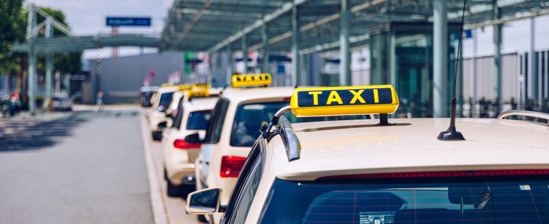 Taxis parked in a line at the airport
