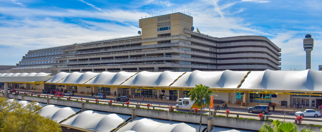 Panoramic view of terminal A , Parking building A and partial view of Air Traffic Control Tower at Orlando Airport (MCO)