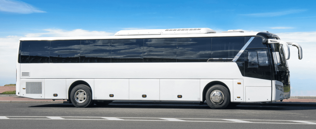 Large white shuttle bus taking passengers to Port Canaveral