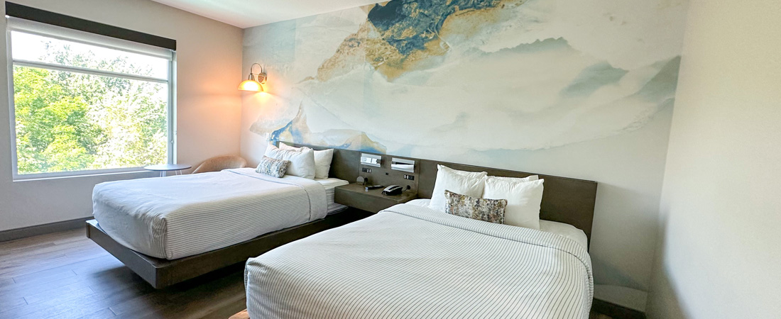 Modern two queen bed hotel room at a hotel near the airport