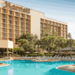 Exterior view of Marriott Orlando Airport with swimming pool out front