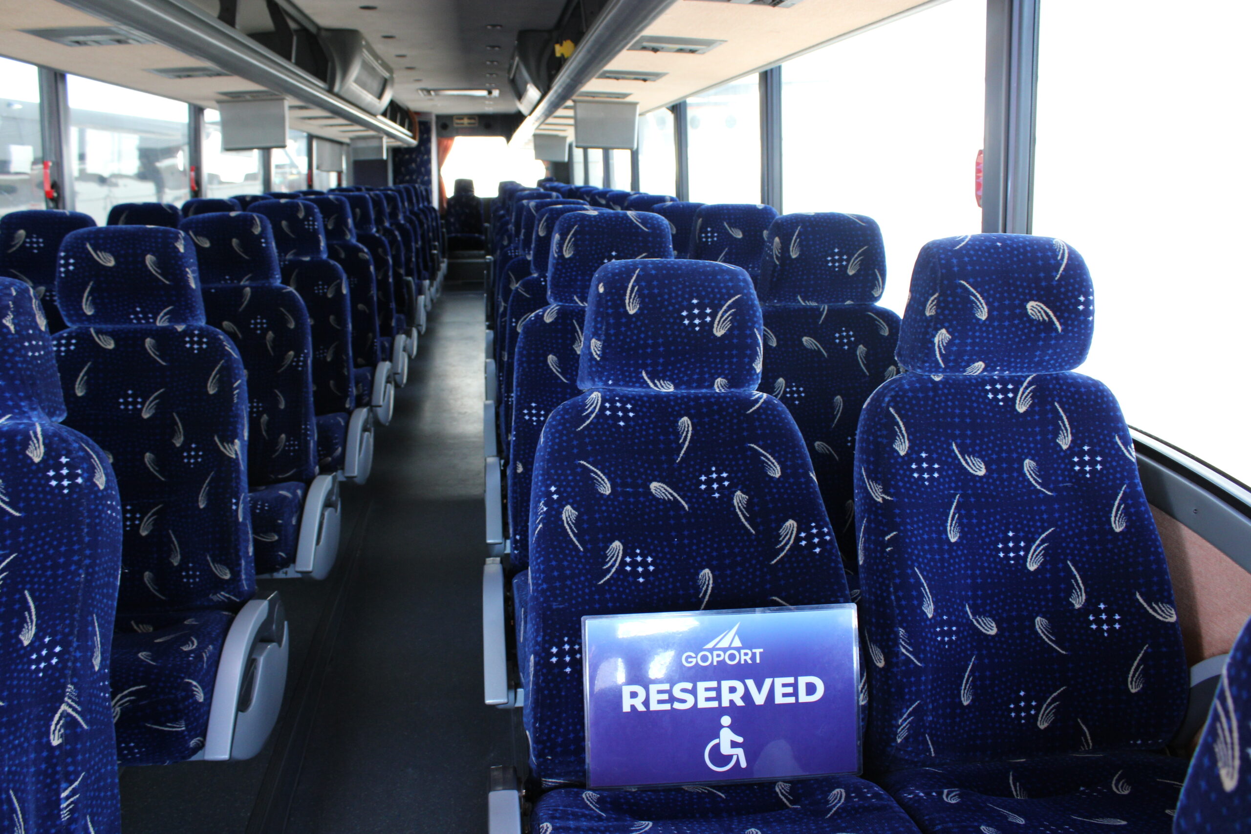 accesibilty seats held for customers on go port bus