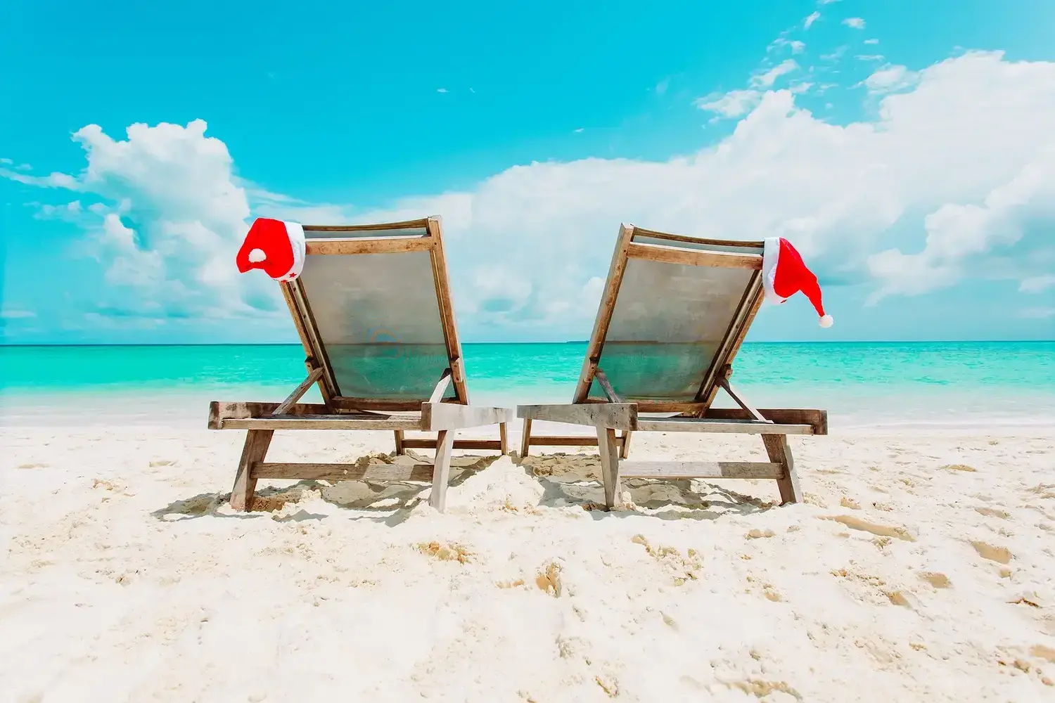 Santa hats on beach chairs