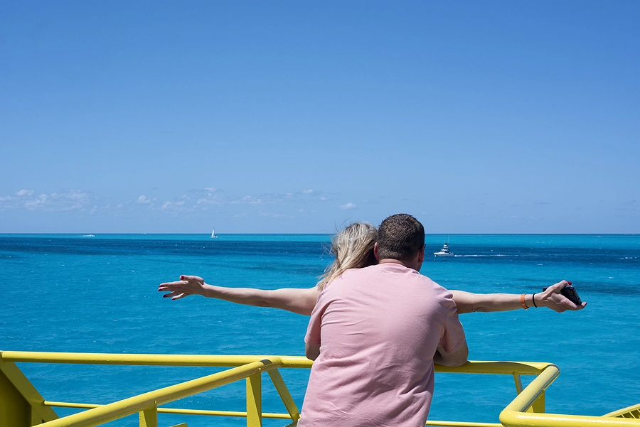 Man and woman holding each other on a cruise