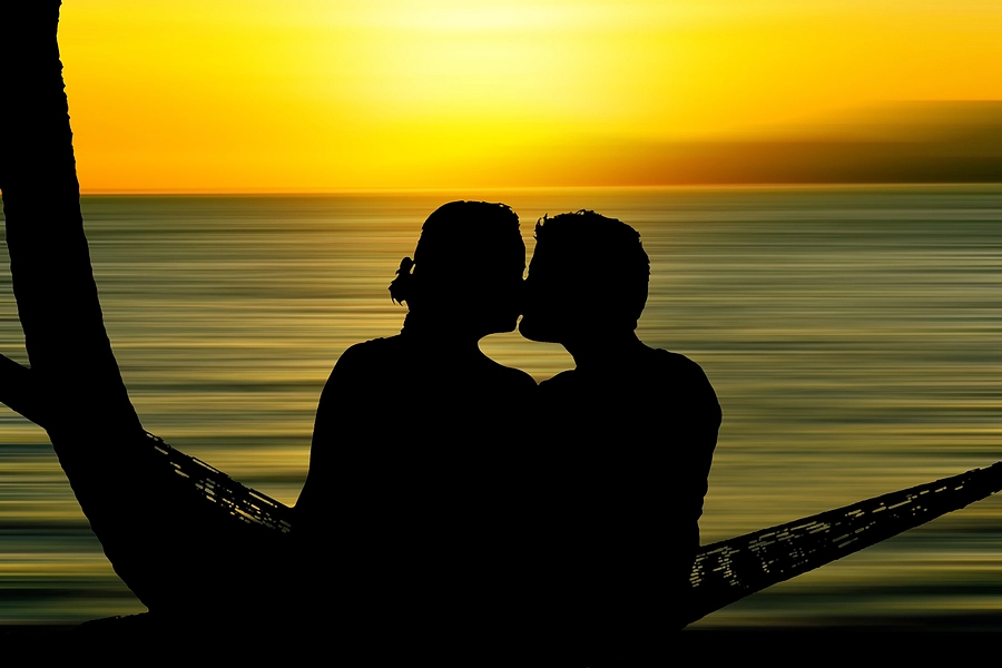 Couple kissing on the beach
