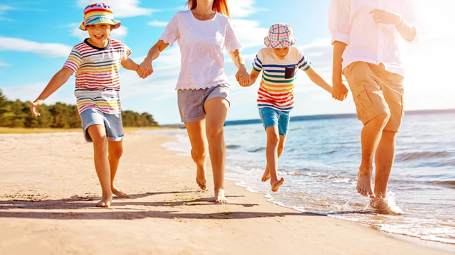 family with children on the beach