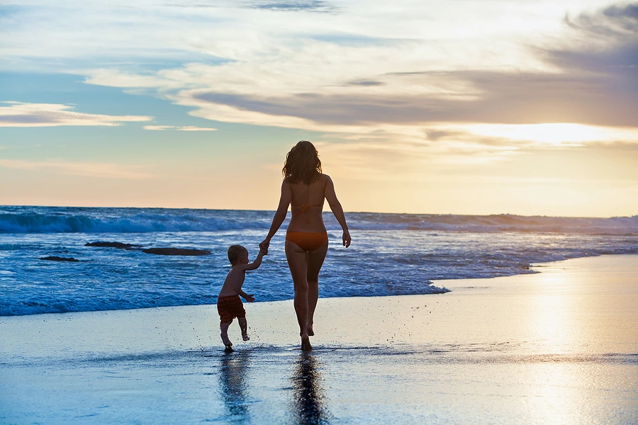 mother and young son on the beach